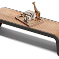 Brown Quilted Leather Bench With Black Frame And Decorative Giraffe Figurine Books Clock