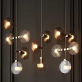 Modern Pendant Lights With Circular Glass Shades And Golden Metal Frames Illuminated