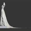 Elegant White Wedding Dress With Intricate Embroidery And Long Train On Mannequin