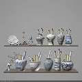 Various Ceramic Vessels with Blue and White Patterns as Decorative Pen Holders on Shelf