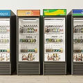 Four Upright Commercial Beverage Refrigerators With Brand Logos And Filled Drinks