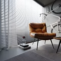 Modern Brown Leather Bean Bag Chair Interior With Side Table Coffee Cup And Wall Bicycle