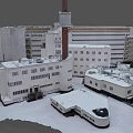 Aerial View of Snow Covered Building Complex with Tower and Parking Lot