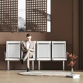 Public Chair With Metal Grid Design In Indoor Lobby With Man Sitting