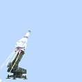 Military Weapon Missile With Blue White Stripes Launched From Camouflage Launcher Emitting Flames