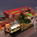 Vibrant Commercial Street With Outdoor Dining Areas Neon Signs Pedestrians Trees And Evening Lights