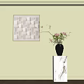 Vase With Pink Flowers On White Marble Pedestal And Square Wall Decoration In Light Green