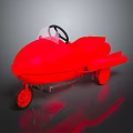 Red Toy Racing Car with Black Steering Wheel and Transparent Windshield on Dark Reflective Surface