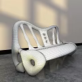 Modern Outdoor Bench Featuring Concrete Material Curved Design and Hollow Details for Patio Garden Use