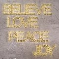 Decorative Letter Lights With BELIEVE LOVE PEACE JOY Words On Wall Warm Yellow Glow