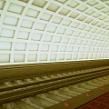 Modern Subway Station with Sleek Train and Grid Pattern Ceiling Lights 3d model