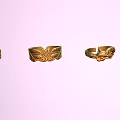 Exquisite Gold Rings With Intricate Carved Patterns On Pastel Pink Background