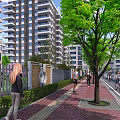 Modern High Rise Residential Building With Green Trees Pedestrian Walkway And Bicyclists