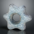 Artistic Wooden Stone Sculpture With Star Shaped Design And Central Circular Hole