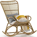 Cozy Rattan Leisure Rocking Chair with Striped Gray Yellow Pillows and Blanket