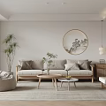 Serene Living Room Interior With Beige Sofa Circular Decorative Painting Floor Plant And Wooden Tables