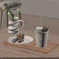White Cup With Straw On Wooden Tray Alongside Donuts And Tulip Vase In Cozy Room