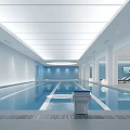 Modern Indoor Swimming Pool With Spacious Bright Interior Blue Walls And Lounge Chairs