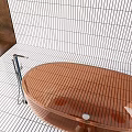 Transparent Blue Bathtub In Bathroom With White Striped Tiles And Silver Faucet