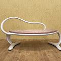 Modern Leisure Chair With White Curved Frame And Pink Cushioned Seat On Wooden Floor