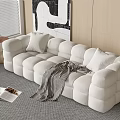 White Sectional Sofa with Plush Cube Design Cushions Striped Throw Blanket and Abstract Wall Art