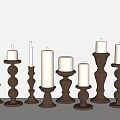 Various Designed Brown Candle Holders With White Lit Candles For Home Decor