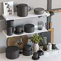 Stylish Gray Kitchenware Collection On Shelves With Wooden Cutting Board And Green Plant