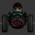 Vintage Green Racing Car Model With Number 63 Driver Black Helmet Goggles And Large Wheels