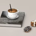 White Coffee Cup with Stirrer on a Thick Book and Donuts with Sprinkles and Ribbon