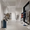 Modern Clothing Store Interior With Hanging Apparel And Minimalist Display Racks