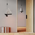 Minimalist Pendant Light With Woven Shade Reflected In Mirror On Light Gray Wall Near Open Book