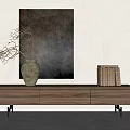 Brown Wooden TV Stand with White Vase Branches and Books Against Wall Painting