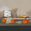 Autumn Themed Decorative Scene With Pumpkins Dried Grass Oranges And Abstract Painting