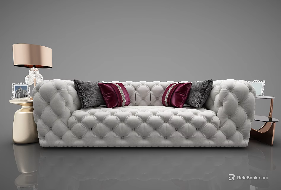 White Tufted Sectional Sofa with Red and Gray Pillows and Beige Table Lamp 3d model