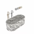 Elegant Modern Marble Bathtub Interior With Polished Brass Faucets And Soft Textile Decor