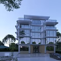 Modern Three Story Detached Villa With Glass Walls Surrounding Trees And Outdoor Parking Area