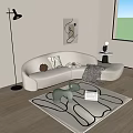 Beige Curved Sectional Sofa With Pillows Blanket Abstract Wall Art Floor Lamp Kids Toy