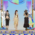 Women in different styles of clothing standing before colorful draperies and ornate background