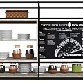 Dinnerware Set Display With Plates Jars Baskets And Taco Time Menu Board