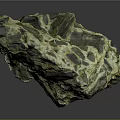 Natural Terrain Rock Formation With Green Black Yellow Surface Texture And Geological Features