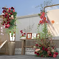 Elegant Floral Installation With Red Roses White Flowers Green Plants And Wooden Screen