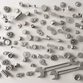 Various Mechanical Parts Collection Including Gears Wrenches Bolts and Nuts on White Surface
