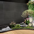 Tranquil Courtyard Garden With Dark Stone Wall Climbing Plants Light Pottery Moss And Wooden Deck
