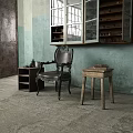 Dark Accent Chair with Blue White Walls Worn Areas Concrete Floor and Small Table