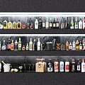 Assorted Wine Bottles and Glasses Displayed on Shelves with Ice Bucket and Lemon Slices