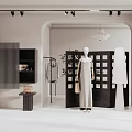Fashion Retail Window Display Featuring Mannequins In Dresses And Minimalist Black White Decor