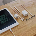 Xiaomi New Digital Accessories With Chargers Data Cables And Tablet Display On Wooden Surface