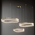 Modern Circular Chandeliers With Golden Frame And Illuminated Strips Hanging In Dark Space
