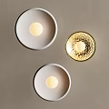 Three Modern Minimalist Wall Lamps with Silver and Beige Circular Base and Golden Orb Design
