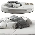 Modern Irregular Round Sofa With Plush Gray And White Pillows For Living Room